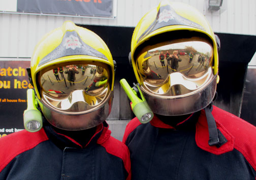 Firemen
        dealing with the chip pan fire